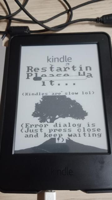 A photo of a Kindle, device for reading e-books that uses E-Ink as a display technology. The photo was taken during the jailbreak process