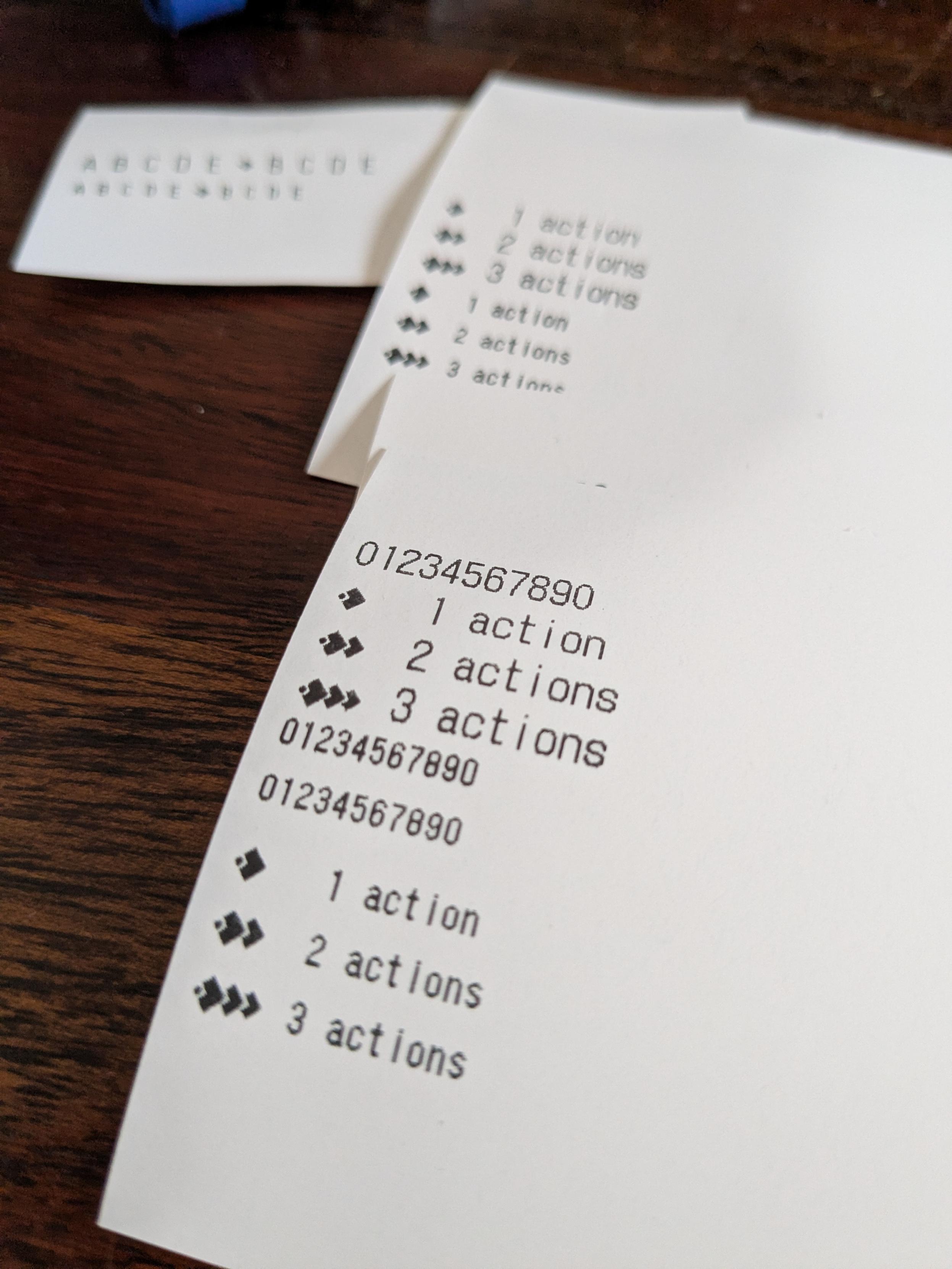 pieces of recept printer paper with test text for printing the standard pathfinder 2e action count characters that look like a row of overlapping diamonds.  test reads: ♦️1 action, ♦️♦️ 2 actions, etc.